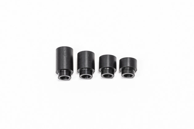 Radium Engineering 27mm insulating spacer for fuel rails, showing the black plastic component with precise dimensions and design features.