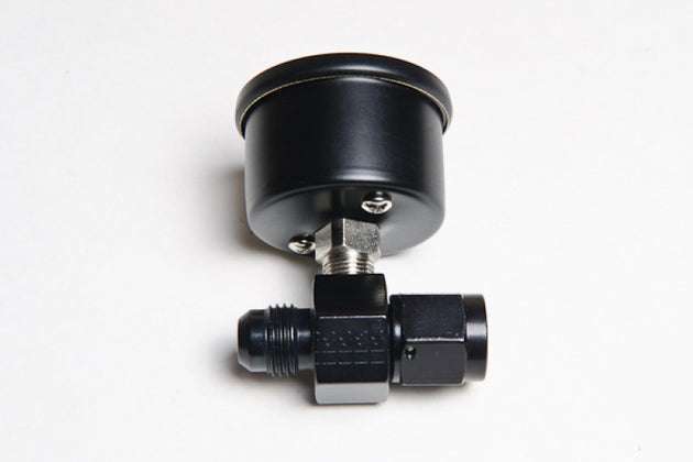 Radium Engineering fuel pressure gauge with 6AN inline adapter, clear dial displaying pressure levels in a high-performance engine setup.