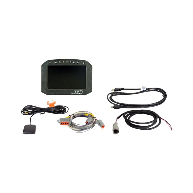 AEM CD-5G Carbon flush digital dash display with internal 20Hz GPS and antenna, showing gauges in a car dashboard setup.