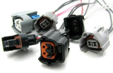 DeatschWerks Sumitomo fuel injector connector housing and pins for re-pining, showing detailed electrical components and wiring connections.