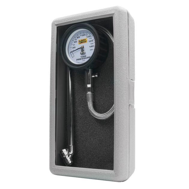 AutoMeter 150 PSI analog tire pressure gauge showing dial face with measurement needle and pressure markings.