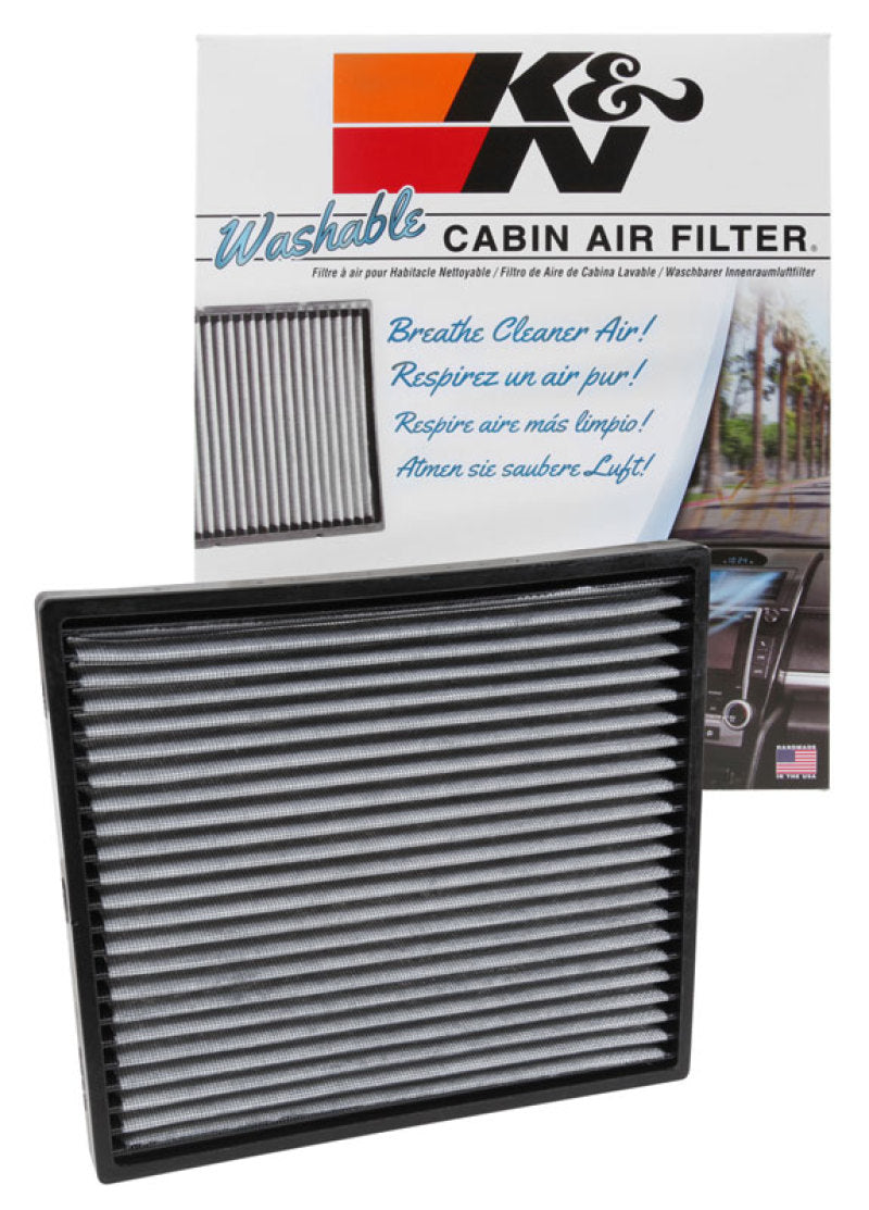 K&N Engineering Cadillac CTS 3.6L cabin air filter installed in vehicle, showing clean filter with pleated design and filter frame