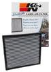 K&N Engineering Cadillac CTS 3.6L cabin air filter installed in vehicle, showing clean filter with pleated design and filter frame