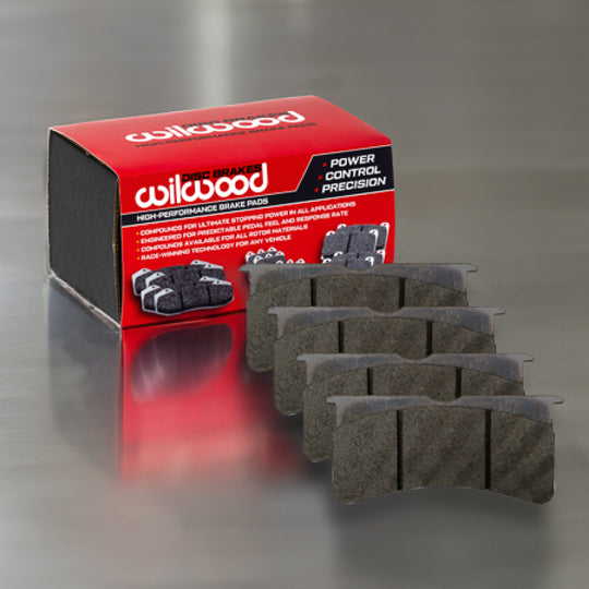 Wilwood BP-40 racing brake pad set showing two black brake pads with metal backing plates, designed for high-performance racing vehicles.