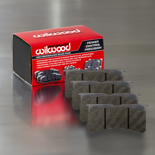 Wilwood BP-40 racing brake pad set showing two black brake pads with metal backing plates, designed for high-performance racing vehicles.