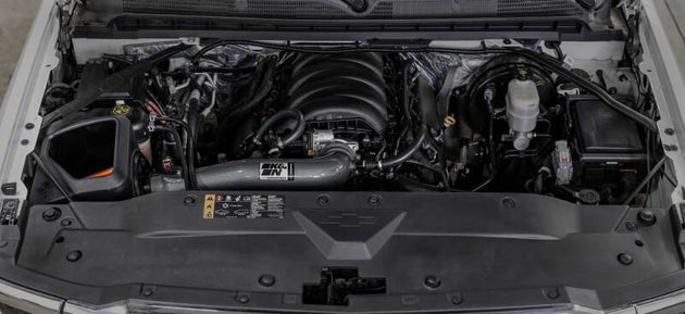 K&N Engineering Chevy/GMC 1500 V8 5.3L/6.2L NextGen aluminum cold air intake system installed in engine bay.