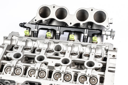Radium Engineering Toyota 3S-GE/3S-GTE Gen 3-5 fuel rail showing metal construction, mounting points, and inlet connections.