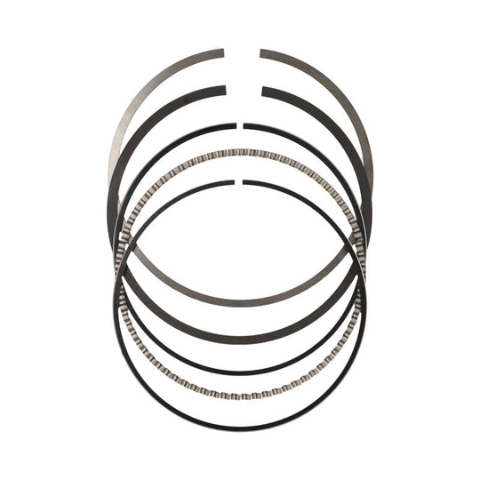 JE Pistons piston ring set with multiple rings, labeled 99.5 and 79, featuring high-performance engine components and precise fit.