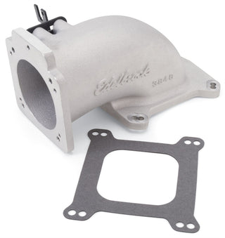 Edelbrock low profile intake elbow with 90mm throttle body and square-bore flange, finished in as-cast for performance engine upgrade.