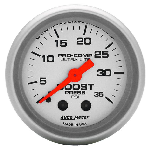 AutoMeter Ultra-Lite 52mm mechanical boost gauge showing 35 PSI, black face with white markings and a metallic bezel.