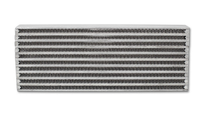 Vibrant universal oil cooler core, 4x12x2 inches, showcasing vibrant metal fins and fittings for efficient engine oil cooling.
