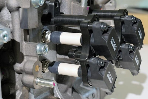 HKS Super Fire Racing Coil Pro FD3S RX-7 stock replacement ignition coil installed in a Mazda RX-7 engine bay