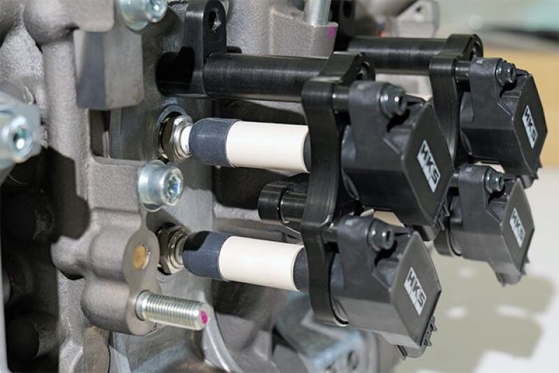 HKS Super Fire Racing Coil Pro FD3S RX-7 stock replacement ignition coil installed in a Mazda RX-7 engine bay