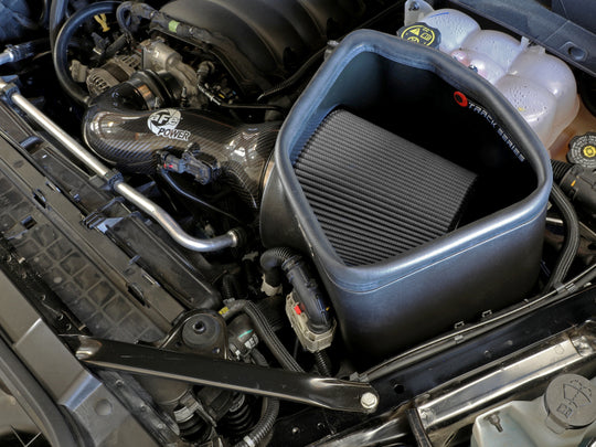 aFe 19-21 GM trucks 5.3L/6.2L Track Series carbon fiber cold air intake system with Pro Dry S filters installed in engine bay