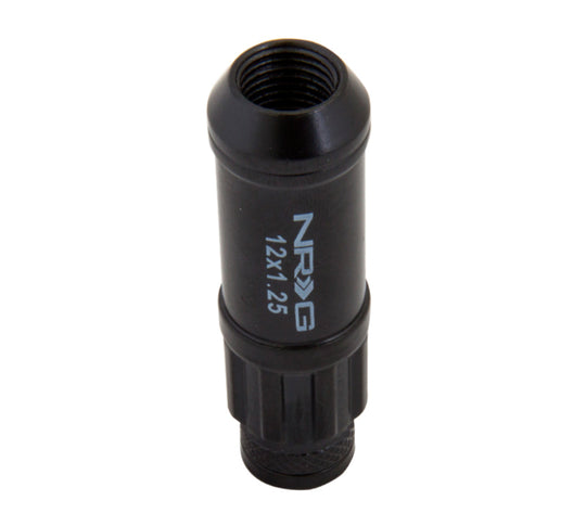 NRG 700 Series M12 X 1.25 steel lug nut set with dust cap covers, locks, and lock socket in black for automotive wheels.
