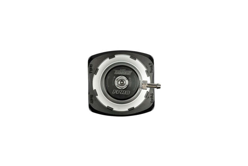 Turbosmart FPRF8 black fuel pressure regulator and filter mounted on engine components.