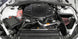 K&N Engineering silver Typhoon short ram intake for 2016-2017 Chevy Camaro 3.6L cold air intake system showing the intake tube and filter