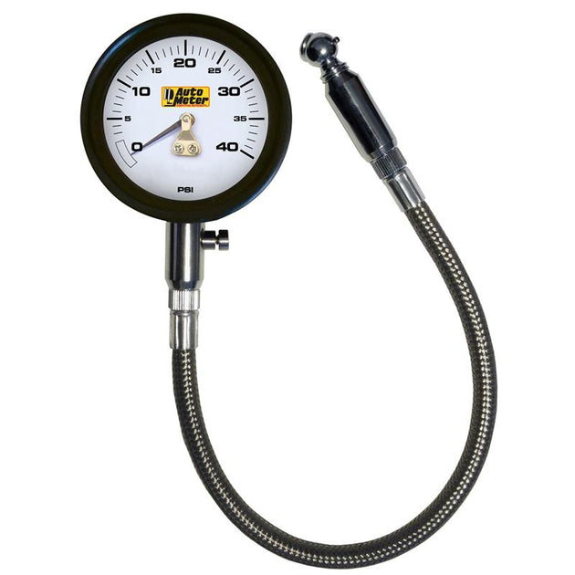 AutoMeter NASCAR Performance 40 PSI tire pressure gauge showing a close-up of the dial and needle in a black and silver design.