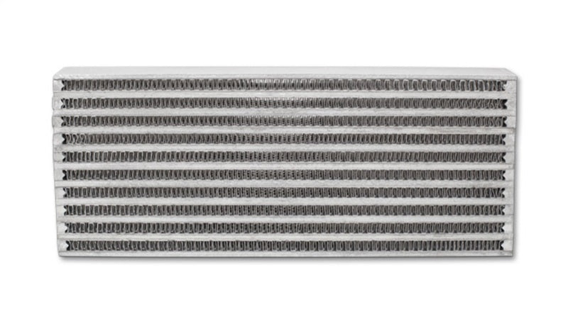 Vibrant universal oil cooler core, 4x10x1.25 inches, with metal fins and inlet/outlet ports for automotive oil cooling systems