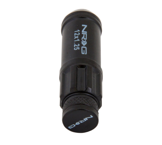 NRG 700 Series M12 X 1.25 steel lug nut set with dust cap covers, locks, and lock socket in black for vehicle wheels.