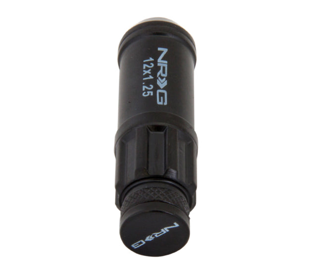 NRG 700 Series M12 X 1.25 steel lug nut set with dust cap covers, locks, and lock socket in black for vehicle wheels.