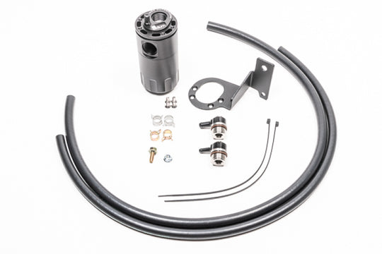 Radium Engineering MK5 Supra oil catch can kit, fluid lock system with black aluminum construction and hoses attached.