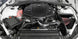 K&N Engineering silver Typhoon short ram cold air intake installed in a 2016-2017 Chevy Camaro 3.6L engine bay.