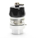 Turbosmart Vee Port Pro black blow off valve installed on a vehicle, showcasing its compact design and matte black finish.