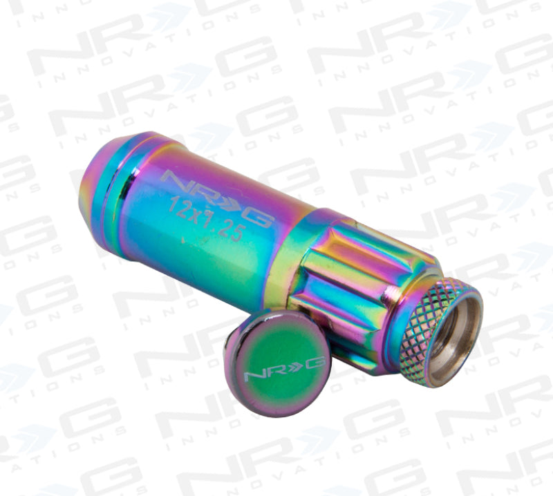 NRG 700 Series M12 x 1.25 steel lug nut set with dust caps, locks, and lock socket in neochrome finish, displayed on a vehicle wheel.