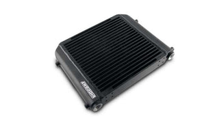 Vibrant single pass oil cooler assembly, 12x12x2 inches, with metal fins and inlet/outlet ports for automotive oil cooling.