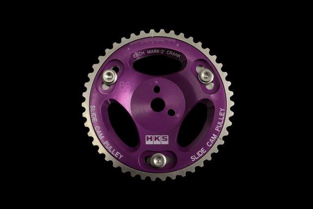 HKS slide cam pulley for B6/BP engine, lightweight cam gear with precision engineering, shown in black with detailed grooves.