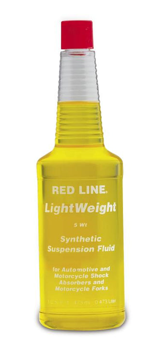 Red Line lightweight 5WT suspension fluid in a 16oz bottle, designed for hydraulic and suspension system lubrication.