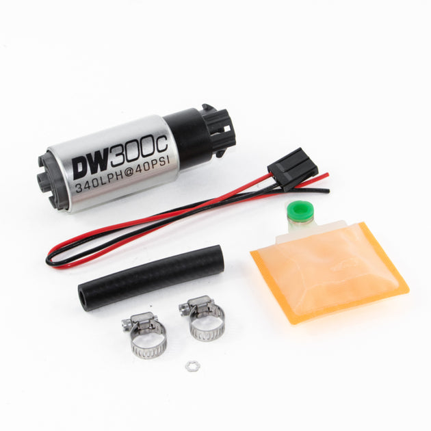 DeatschWerks 340lph DW300C compact fuel pump with universal install kit and mounting clips, shown installed in a vehicle.