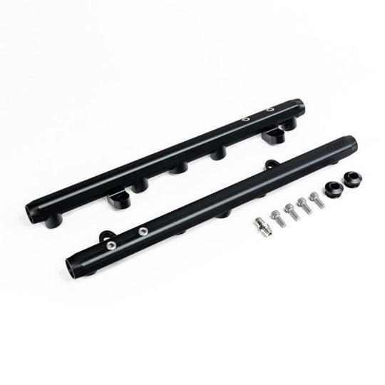 DeatschWerks Chevrolet LS2/LS3 fuel rails installed on engine, showcasing durable metal construction and precise fit for performance.
