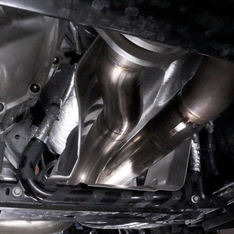 Stainless Works 2017 F-150 Raptor 3.5L downpipe with high-flow cats and factory connection, installed on the vehicle's exhaust system.