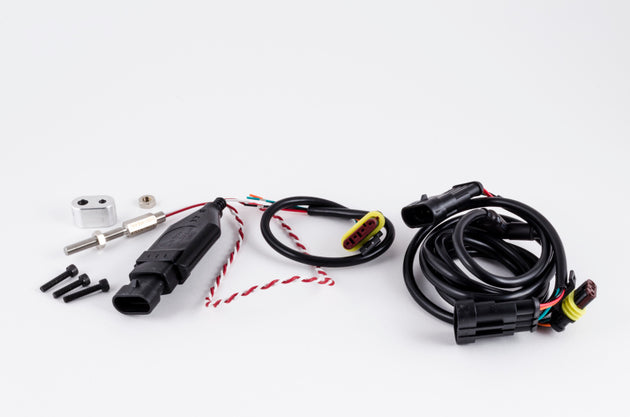 Garrett Pro speed sensor component for gauges, shown as a small electronic device with wiring for automotive performance use.