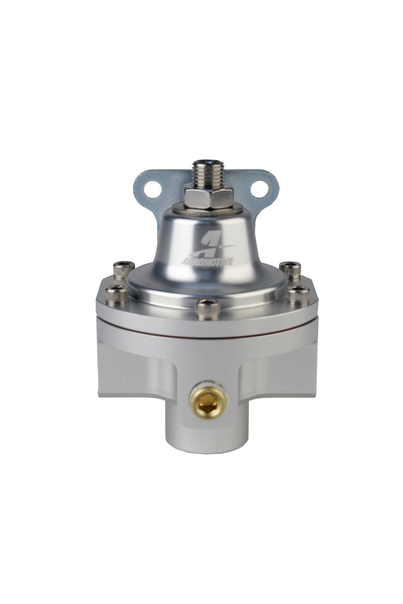 Aeromotive 3-port carbureted bypass fuel pressure regulator with two ORB-06 and one ORB-6 fittings, shown on a workbench.