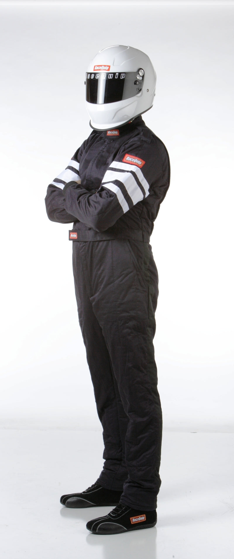 RaceQuip black SFI-5 racing suit in medium size, made of fire-resistant fabric, with racing suit design and branding visible.