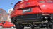 Black CORSA Performance axle-back exhaust for Chevrolet Camaro SS 2017-2024 with 6.2L V8 engine, featuring dual exhaust tips.