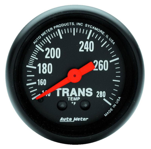 AutoMeter Z Series 52mm mechanical transmission temperature gauge showing a dial from 140 to 280°F with a black face and silver bezel.