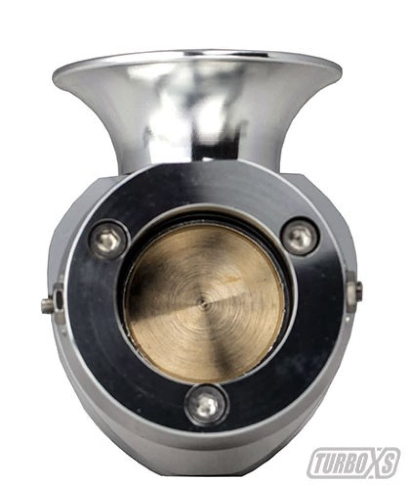 Turbo XS Type H-RFL blow off valve with aluminum piston and O-ring, designed for turbocharged vehicles, mounted on a car engine.