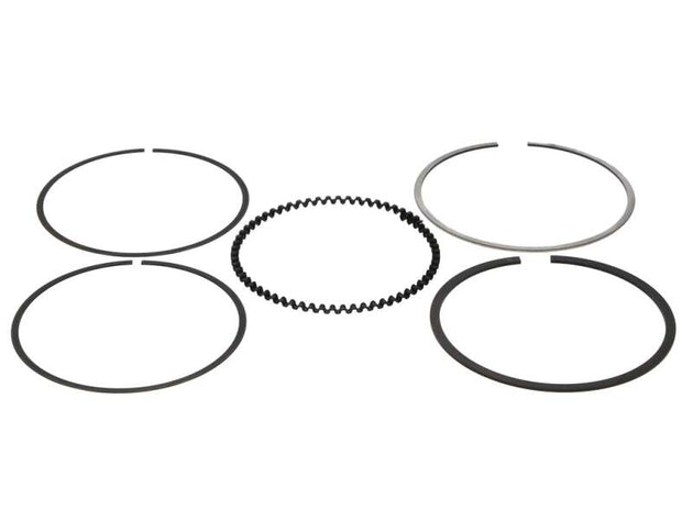 Wiseco piston ring set with 84.25mm rings, featuring 1.0mm, 1.2mm, and 2.8mm thicknesses, displayed on a shelf.