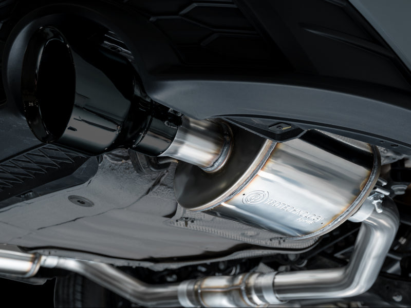 AWE Tuning catback exhaust system with diamond black tips installed on a 2022-2025 Volkswagen Jetta GLI Touring Edition.