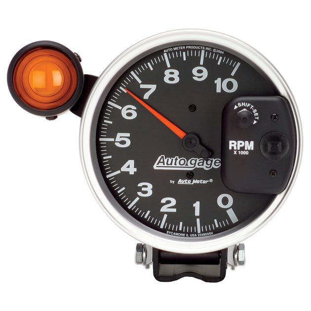 AutoMeter 5-inch Monster Shift Lite Pedestal Tachometer gauge displaying RPM readings with a black face and white numerals