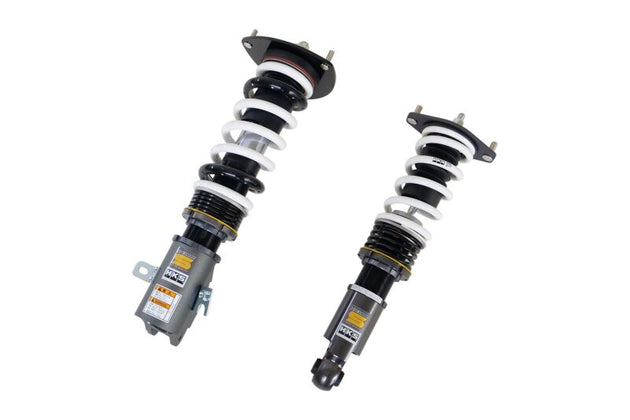 HKS HIPERMAX S coilover suspension kit installed on Subaru WRX STI, showing the adjustable shock absorbers and coil springs.