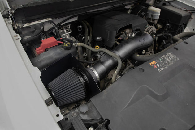 K&N Engineering performance cold air intake system for Chevrolet V8 engines 4.8L to 6.2L, shown installed in engine bay.