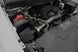 K&N Engineering performance cold air intake system for Chevrolet V8 engines 4.8L to 6.2L, shown installed in engine bay.
