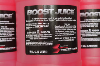 Snow Performance Boost Juice additive case with four gallons, used to enhance engine performance and fuel efficiency.
