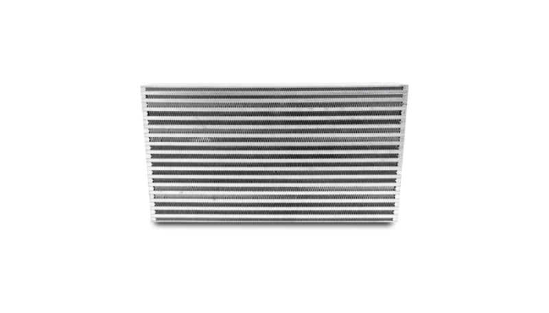 Vibrant air-to-air intercooler core measuring 25x12x3.5 inches, with polished metal fins and end tanks for turbocharged vehicles.