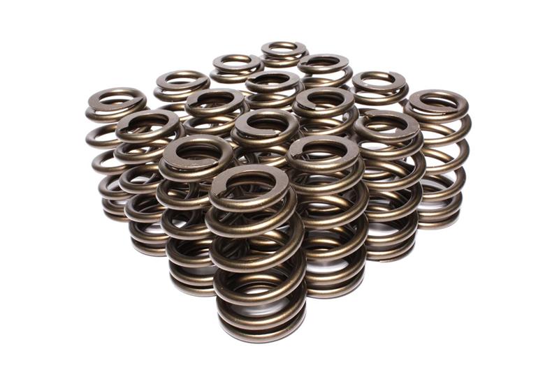 COMP Cams valve springs with 1.185-inch beehive design and retainers, shown installed on engine valves for high-performance automotive use.